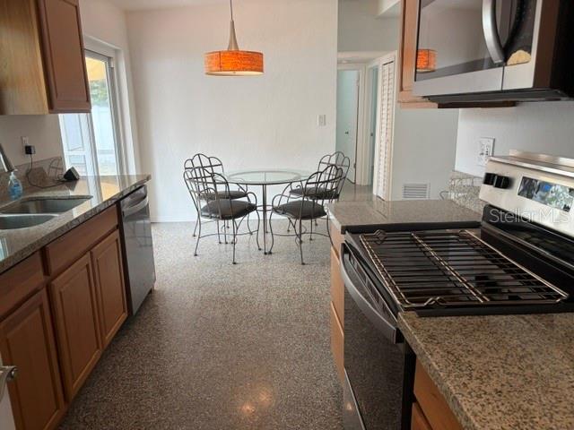 11601 109th Street Seminole, FL 33778 - Photo 8 of 29 a kitchen with a stove and a sink