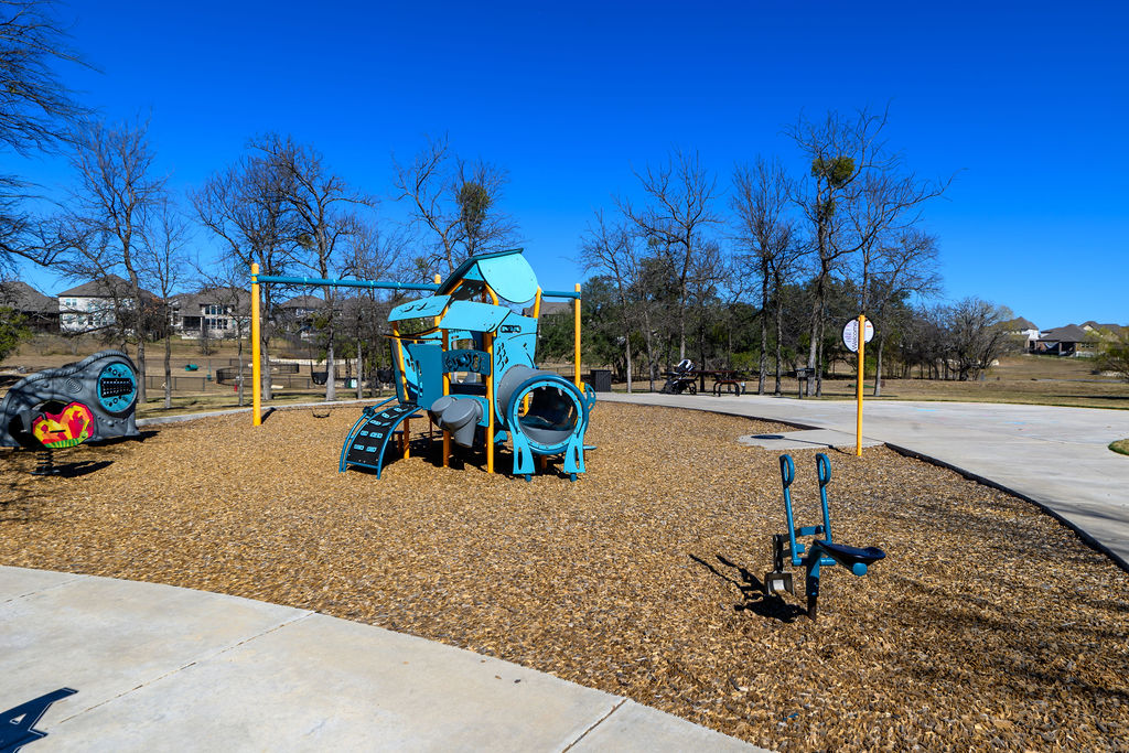 320 Morning Ridge Georgetown, TX 78628 - Photo 4 of 9 a view of a park with swings