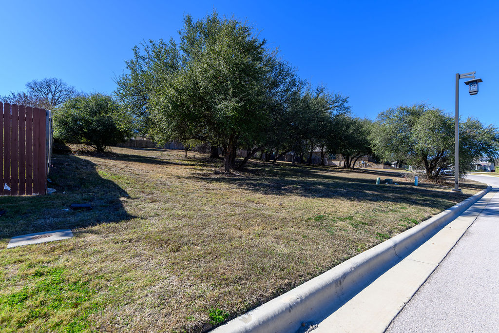 320 Morning Ridge Georgetown, TX 78628 - Photo 8 of 9 a view of swimming pool with a yard and sitting area