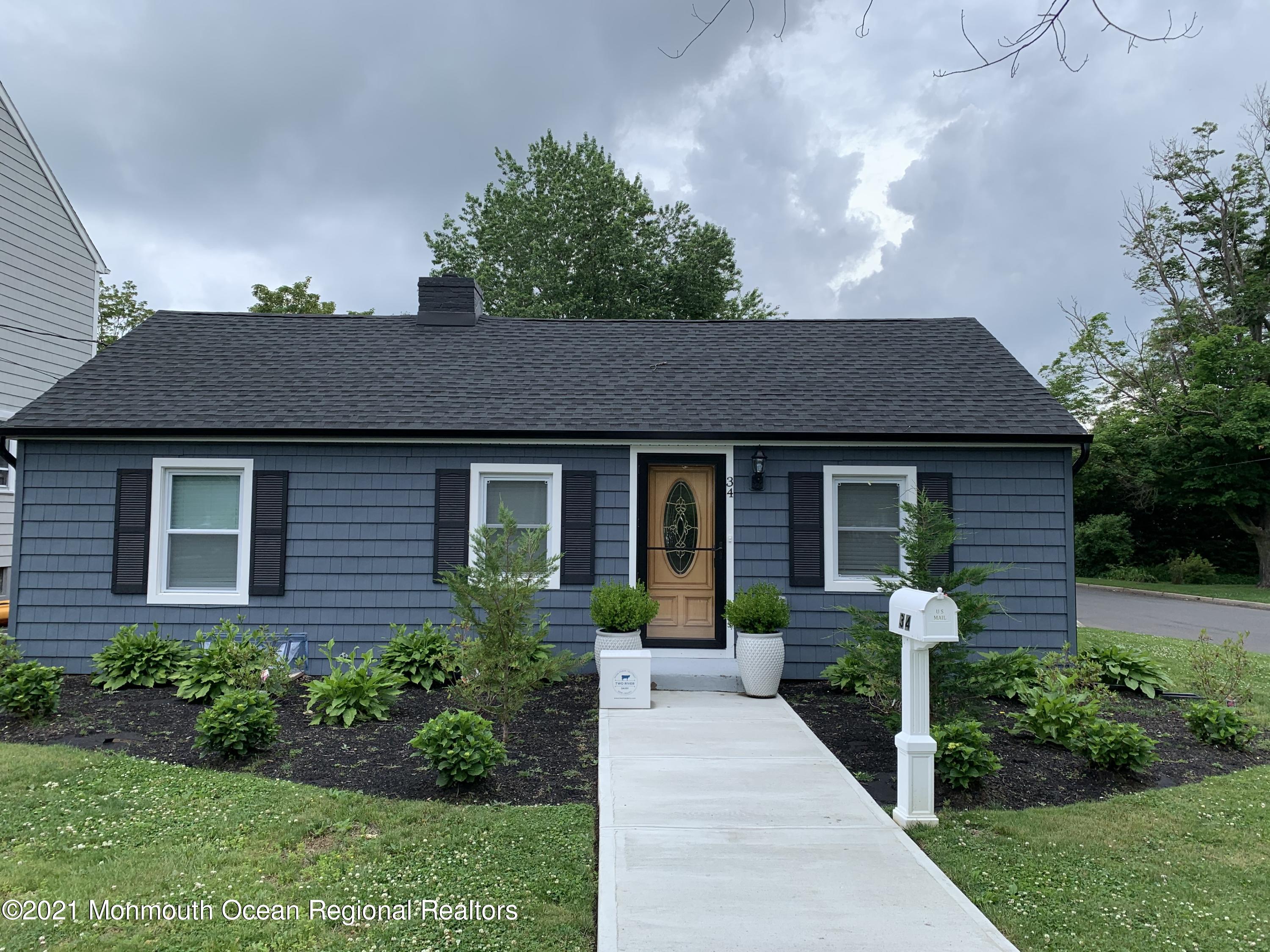 34 Forrest Avenue Rumson, NJ 07760 - Photo 1 of 22 a front view of a house with garden