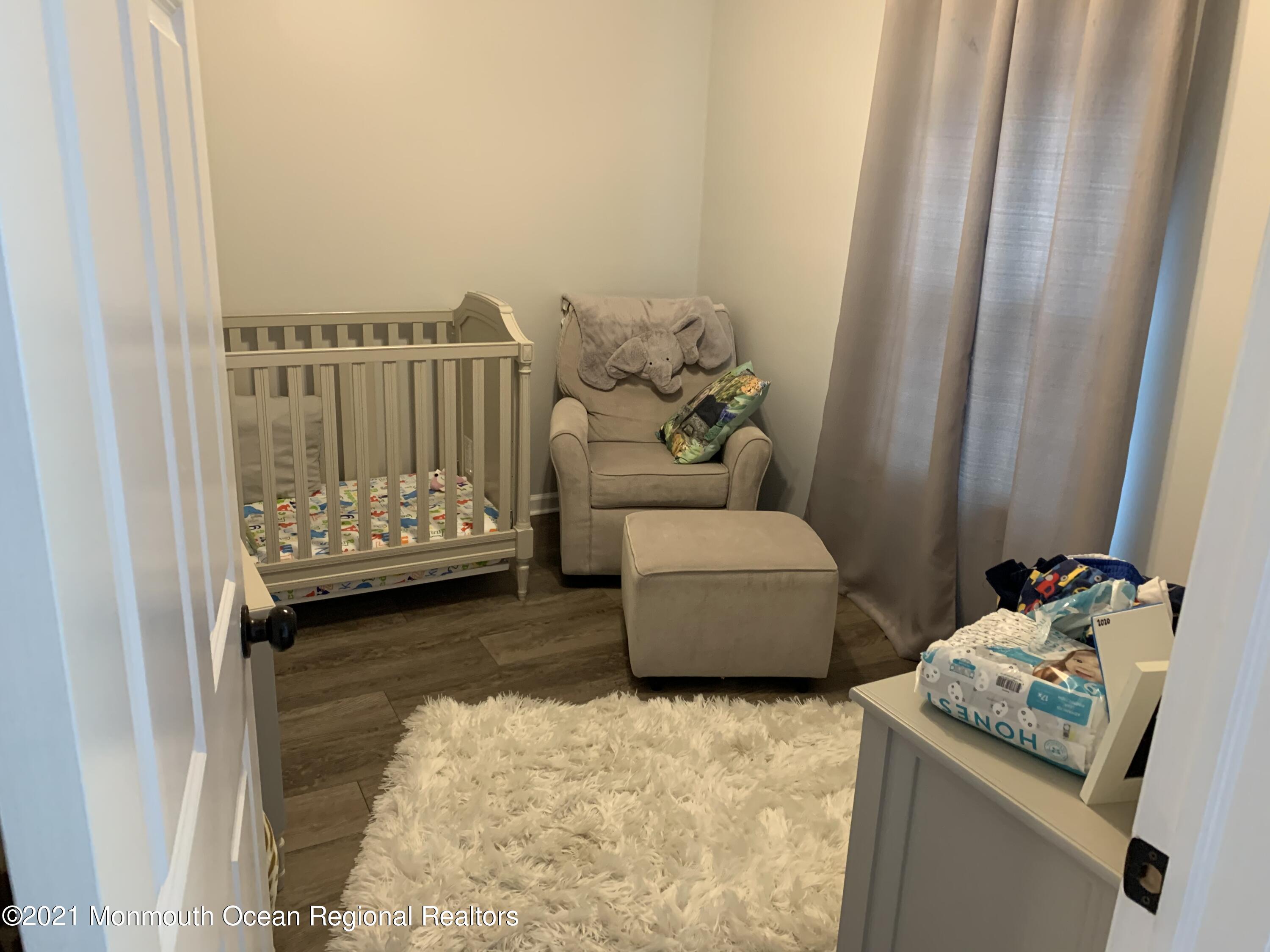 34 Forrest Avenue Rumson, NJ 07760 - Photo 17 of 22 a bedroom with a bed and a couch