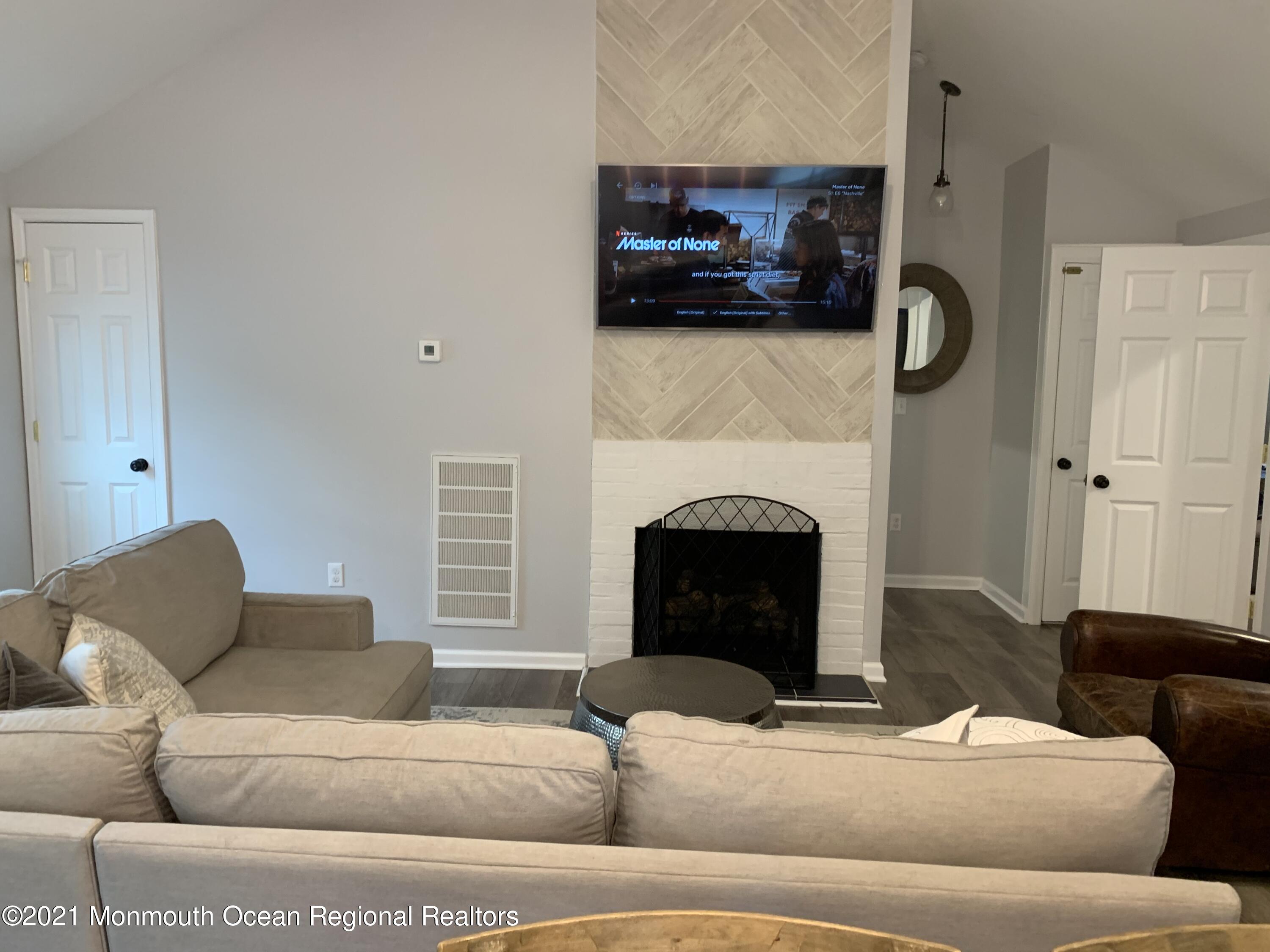 34 Forrest Avenue Rumson, NJ 07760 - Photo 5 of 22 a living room with furniture and a fireplace