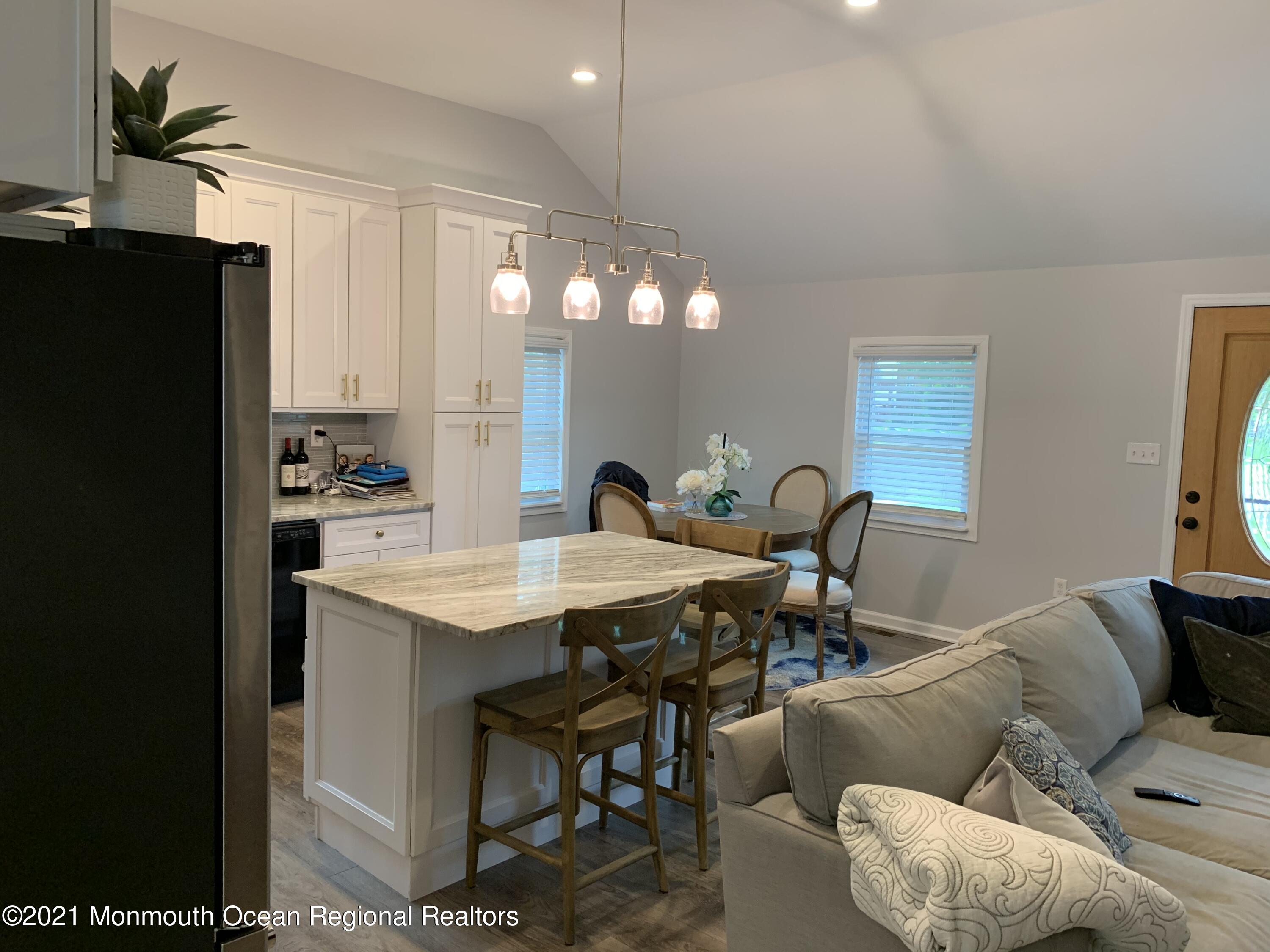 34 Forrest Avenue Rumson, NJ 07760 - Photo 8 of 22 a view of a dining room with furniture and a potted plant