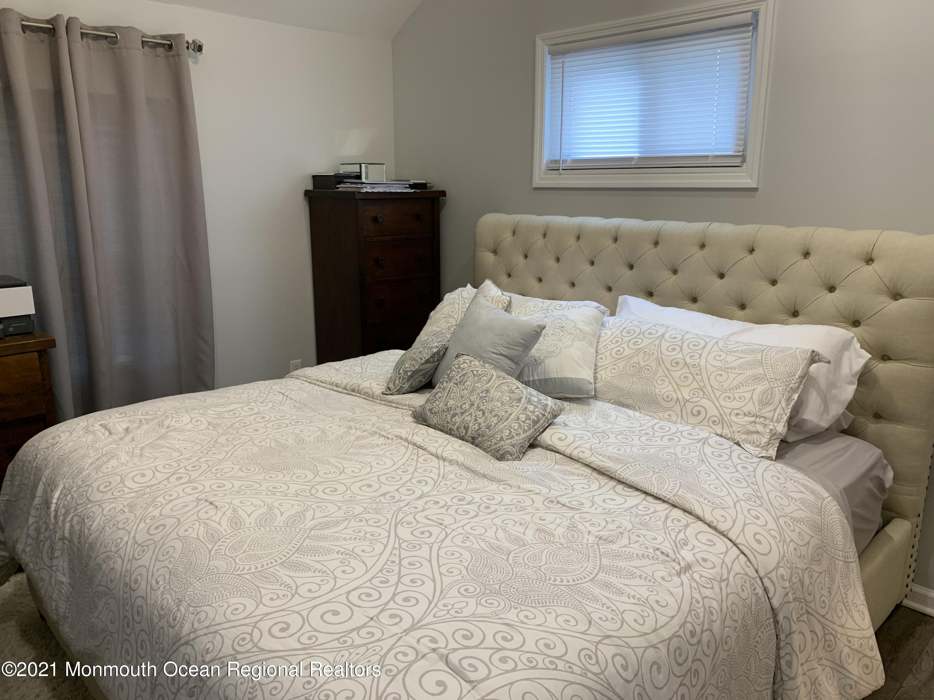 34 Forrest Avenue Rumson, NJ 07760 - Photo 9 of 22 a bedroom with a bed and a window