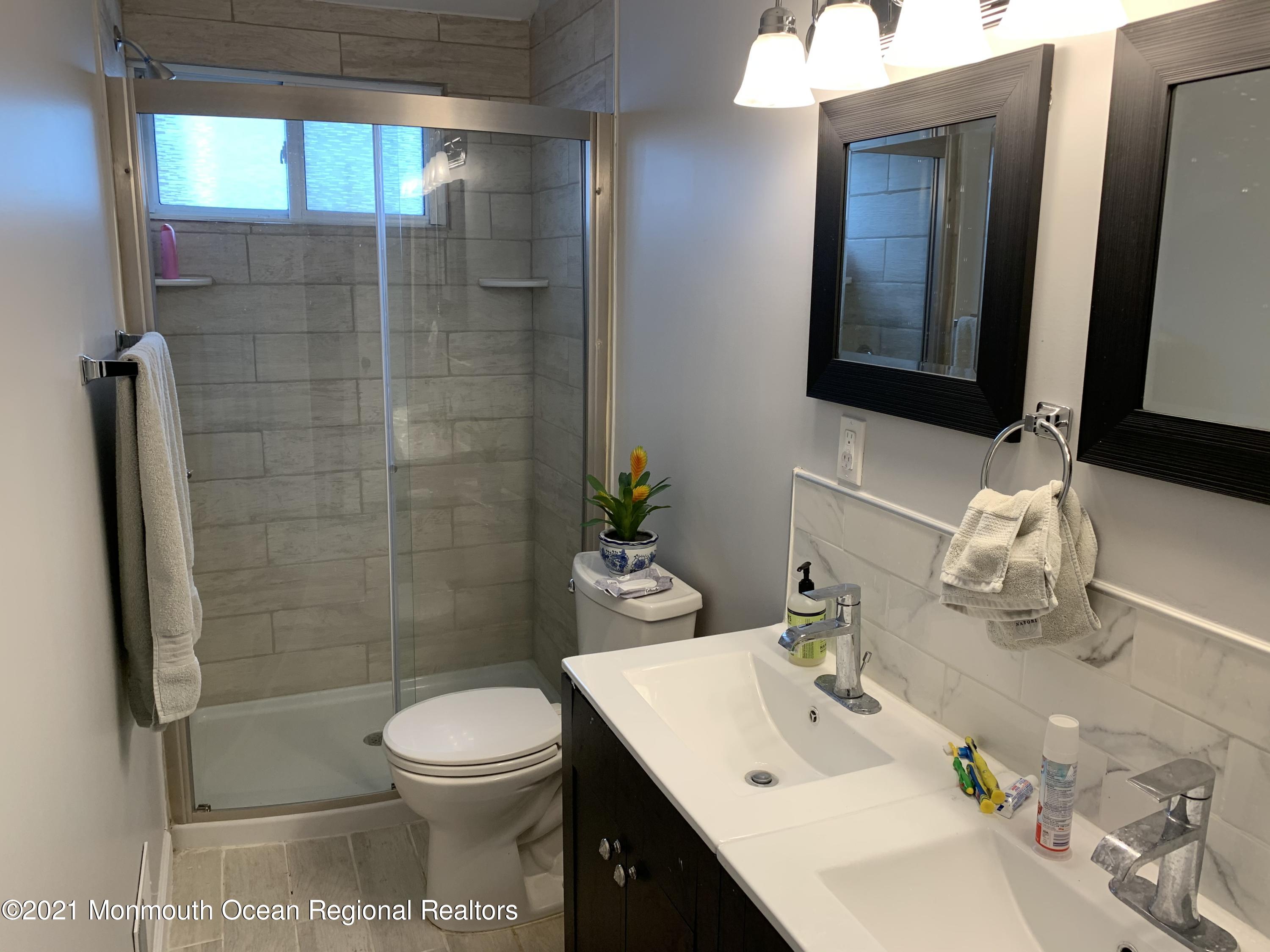 34 Forrest Avenue Rumson, NJ 07760 - Photo 10 of 22 a bathroom with a sink toilet and shower