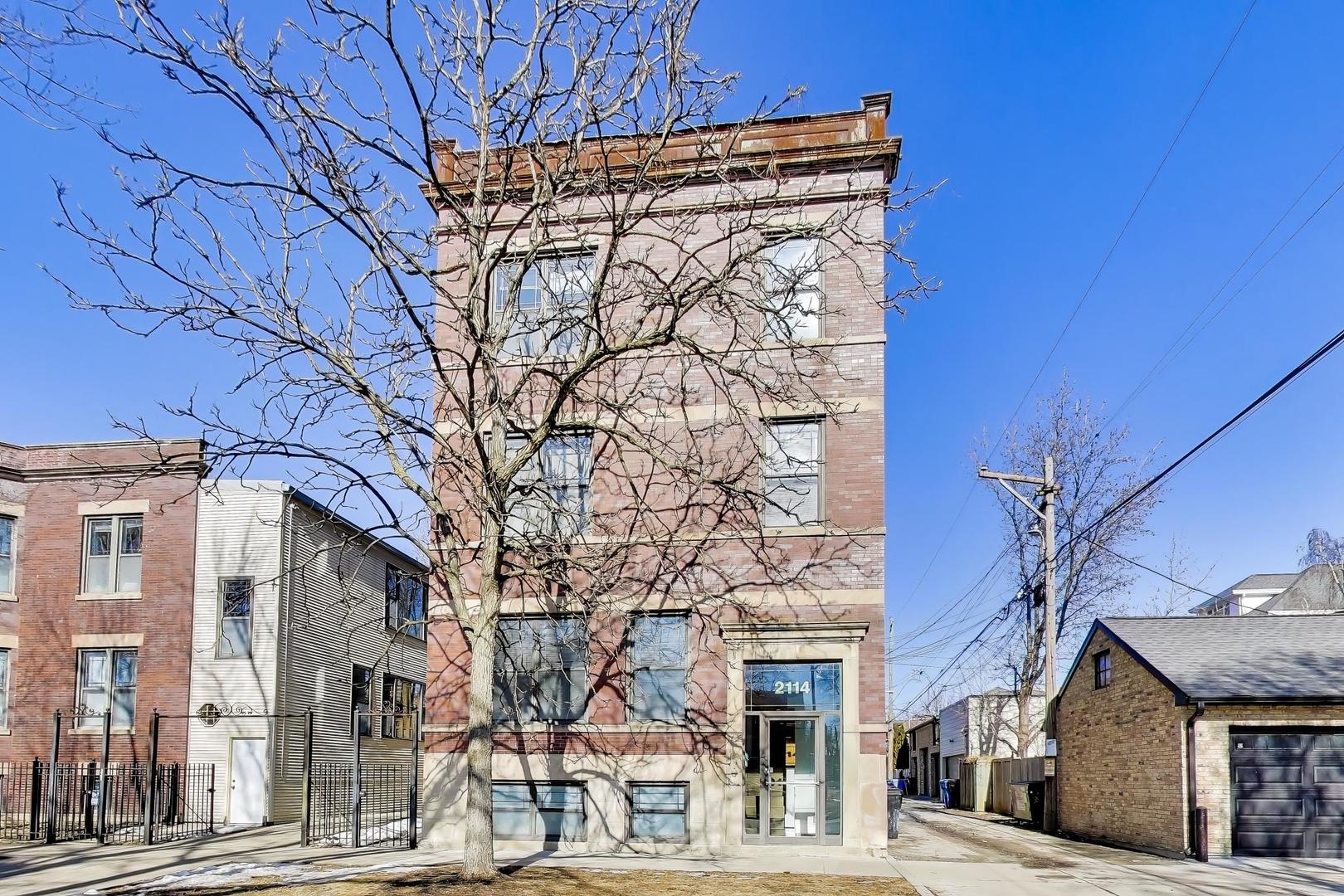 a view of a building with a street