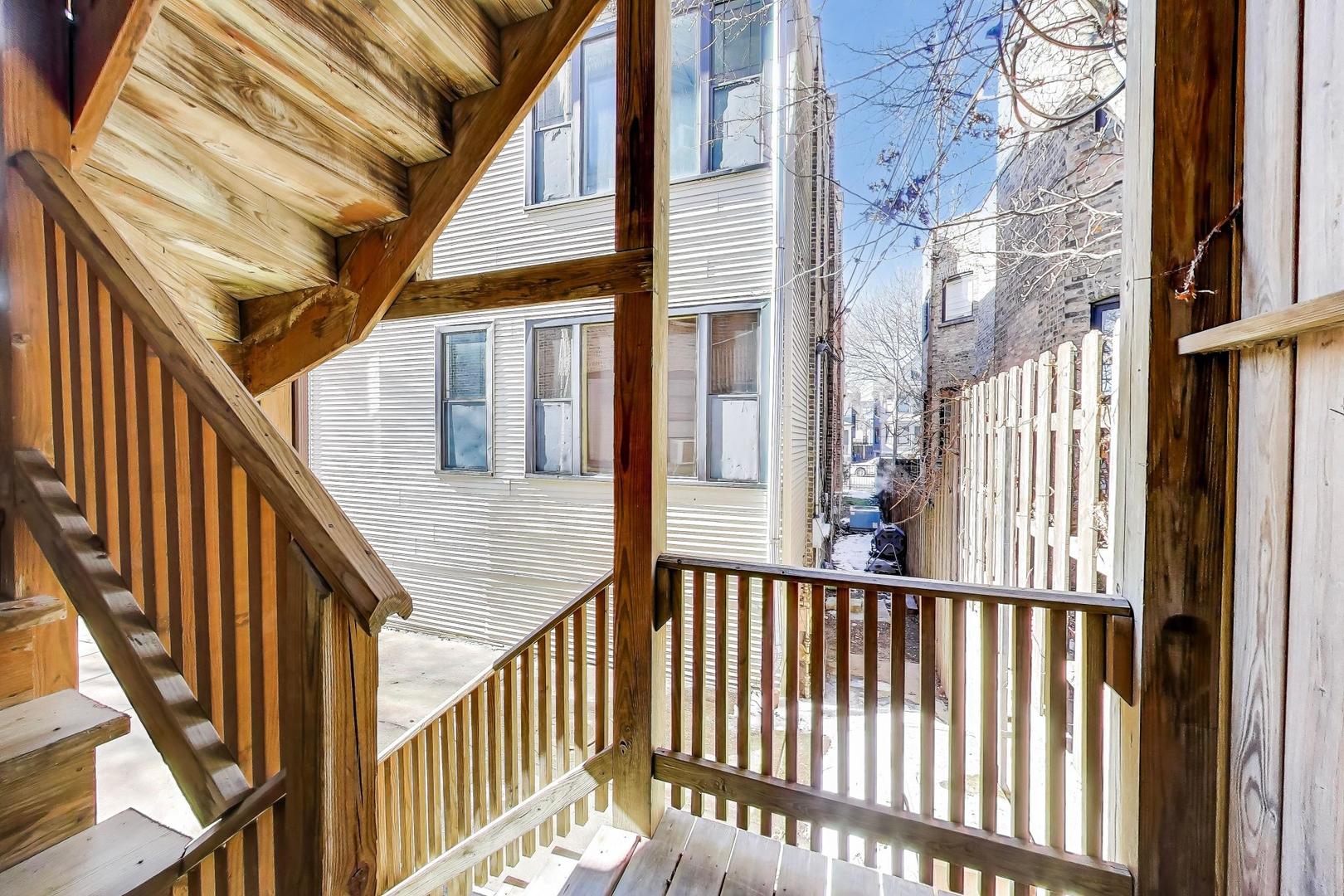 2114 West Byron Street, Unit 1 Chicago, IL 60618 - Photo 23 of 23 a view of staircase with railing and white walls