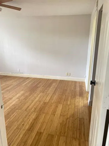 wooden floor in a white room