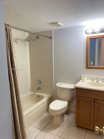 a bathroom with a sink a toilet and a bathtub