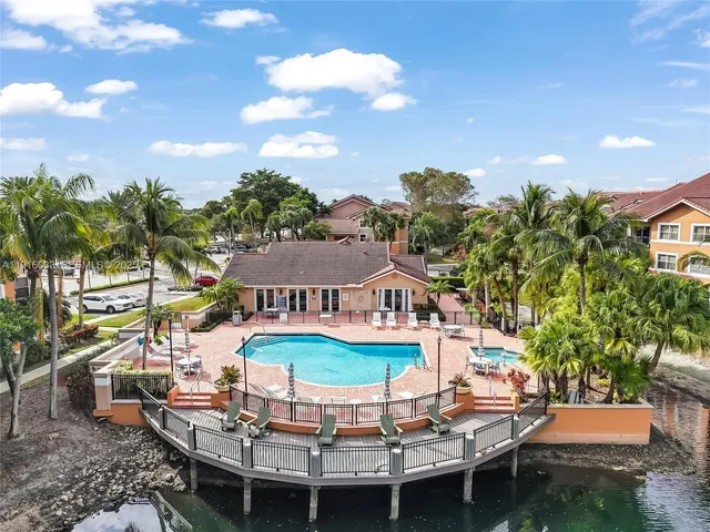 a view of a chairs and table in a patio