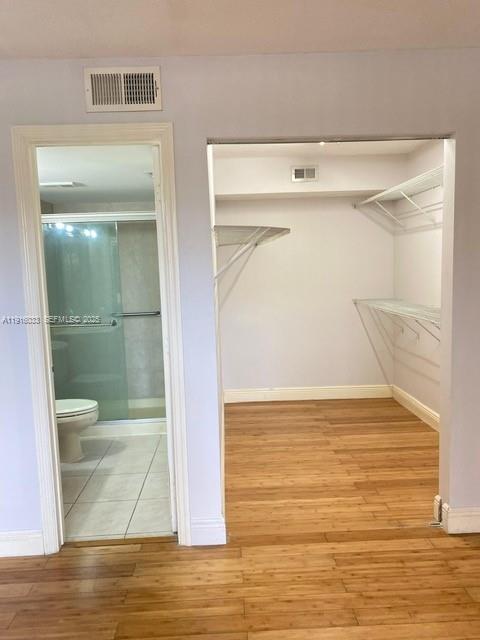 8901 Wiles Road, Unit 103 Coral Springs, FL 33067 - Photo 7 of 14 a view of bathroom and a glass door