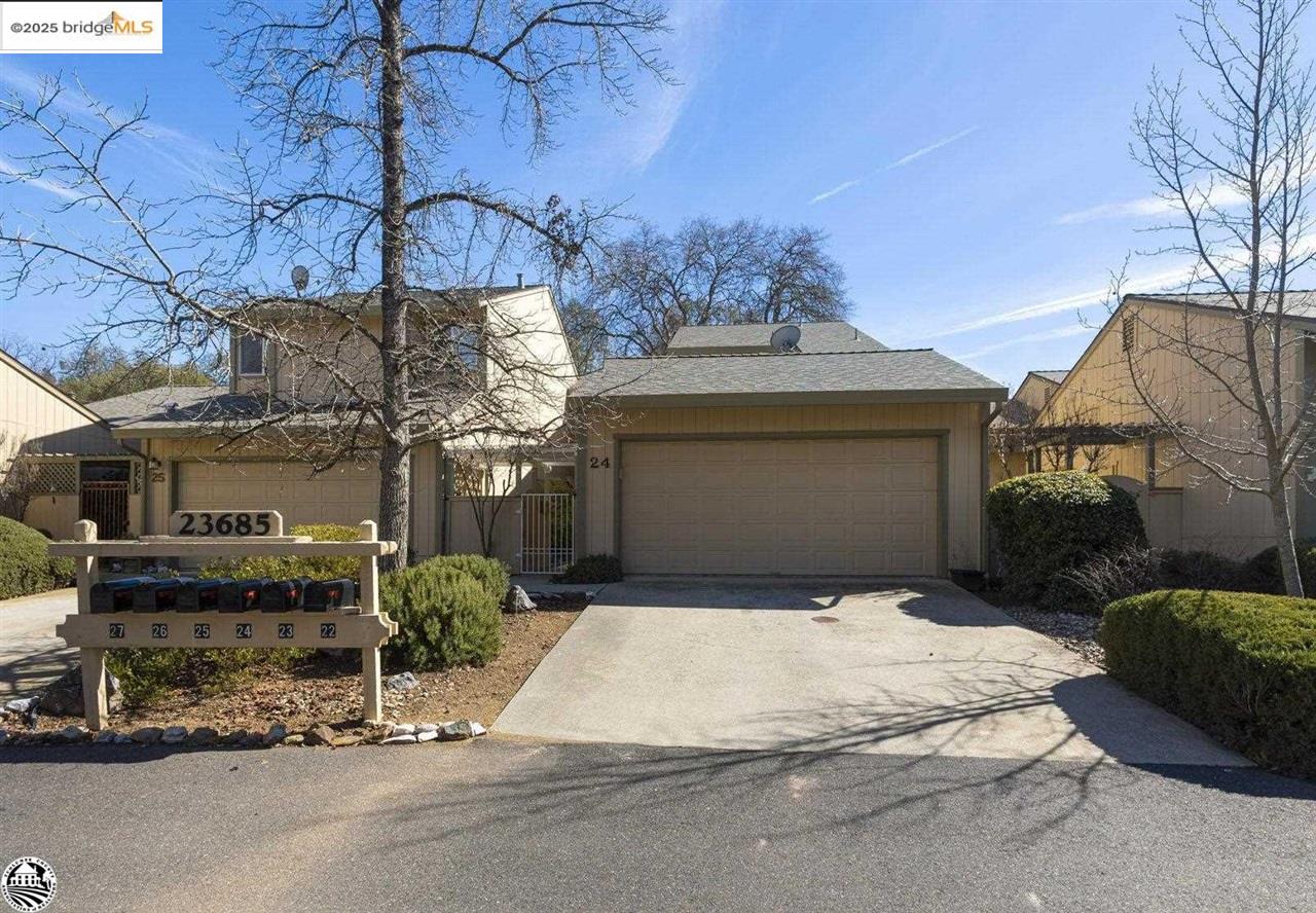 23685 Marble Quarry Road, Unit 24 Columbia, CA 95310 - Photo 1 of 1 a front view of a house with a garage