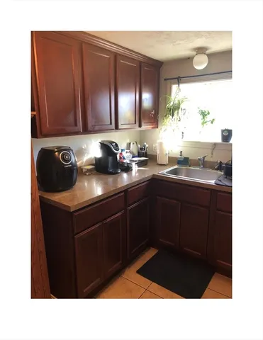 a kitchen with a sink and cabinets