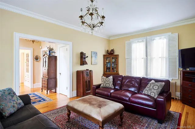a cabinet with a chair and potted plant