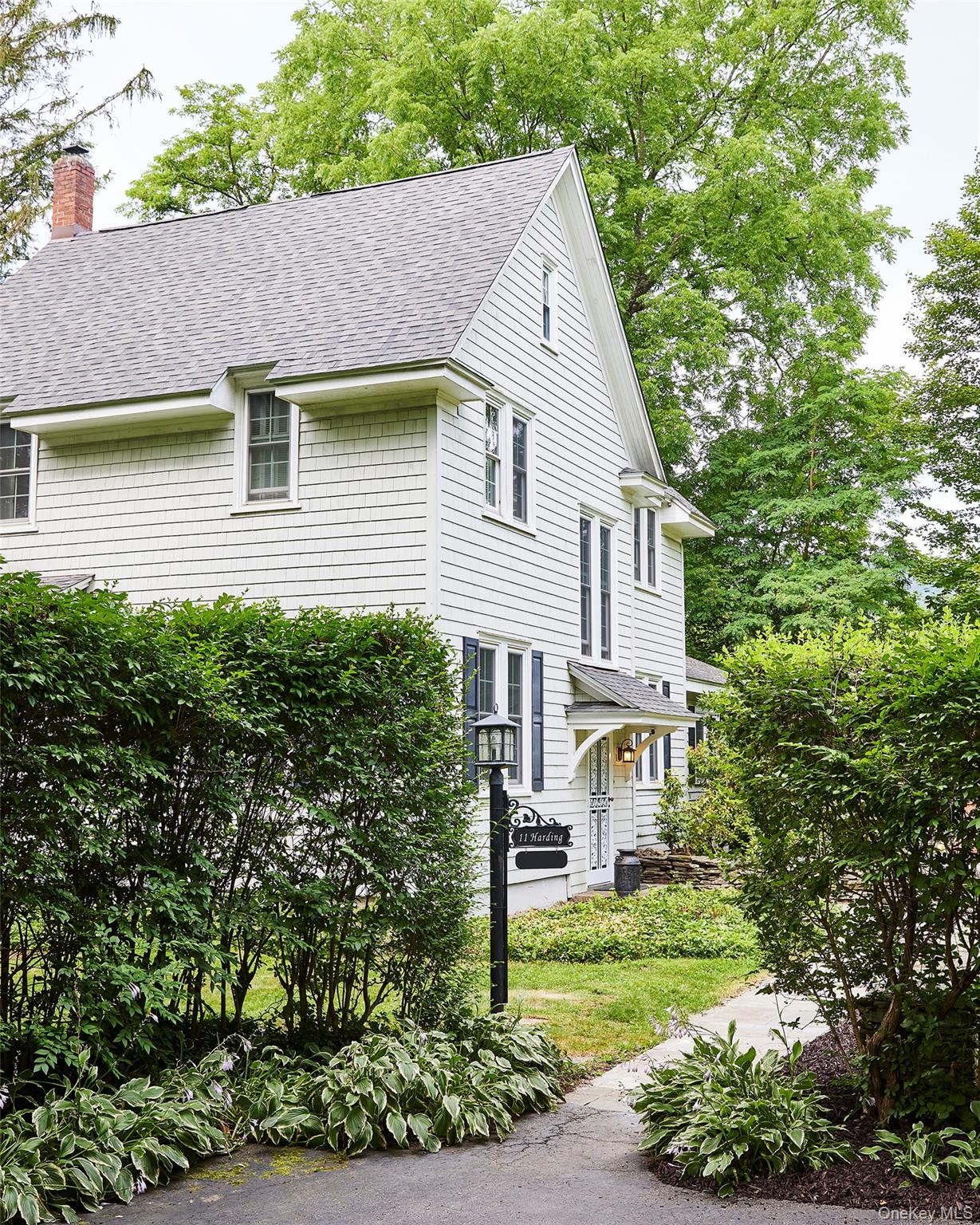 11 Harding Lane Roscoe, NY 12776 - Photo 2 of 48 a front view of a house with garden