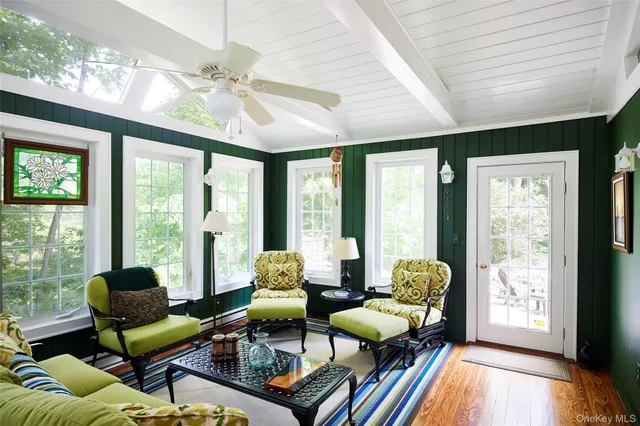 a bedroom with furniture and a rug