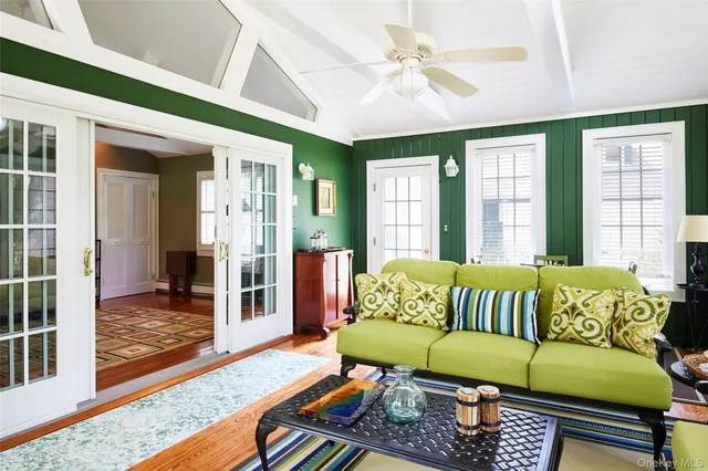 a living room with furniture and a window