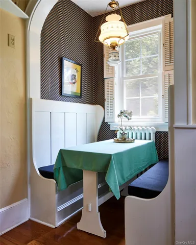 a kitchen with stainless steel appliances a refrigerator sink and wooden floor