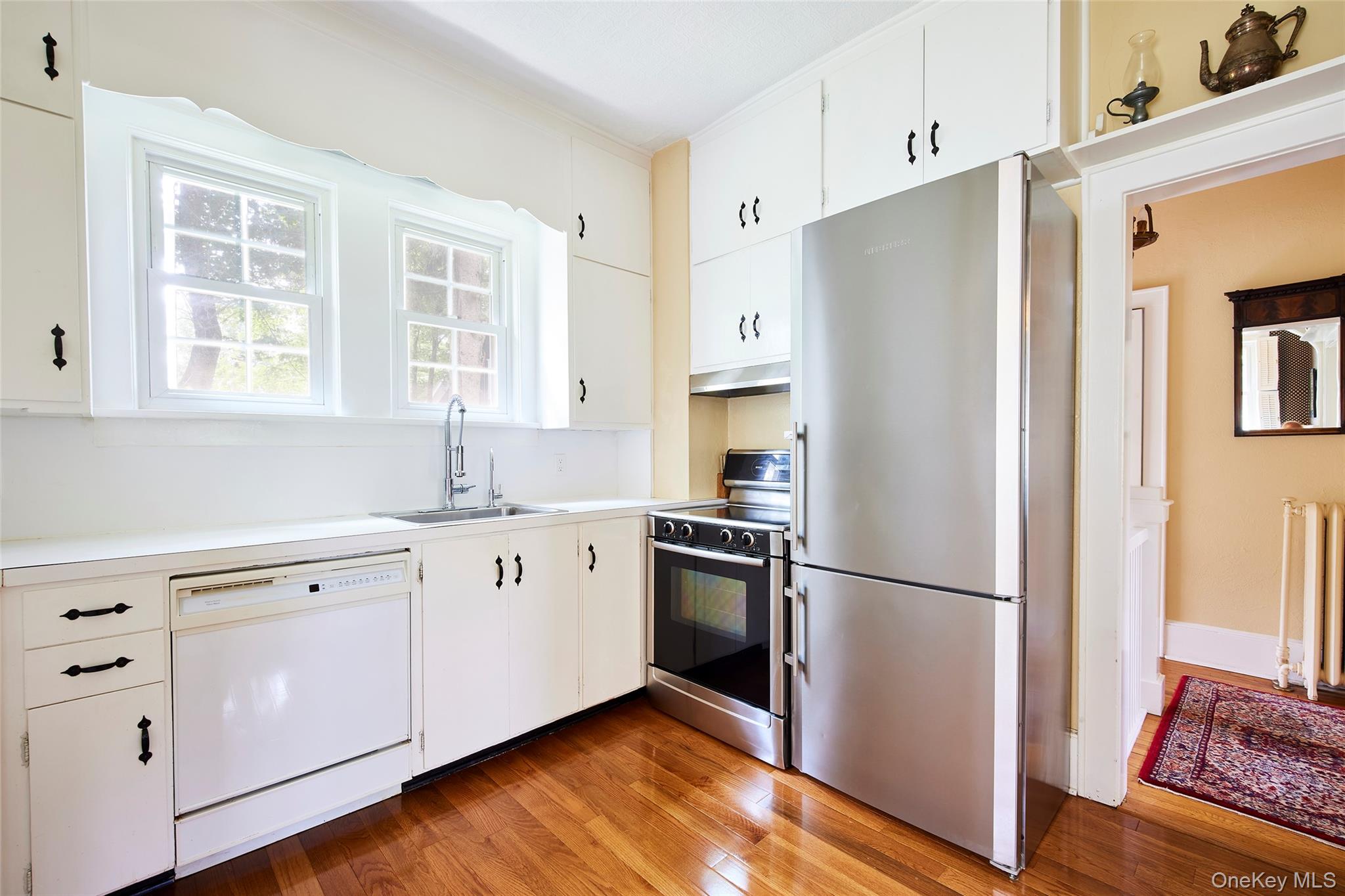 11 Harding Lane Roscoe, NY 12776 - Photo 26 of 48 a kitchen with stainless steel appliances a refrigerator sink and wooden floor