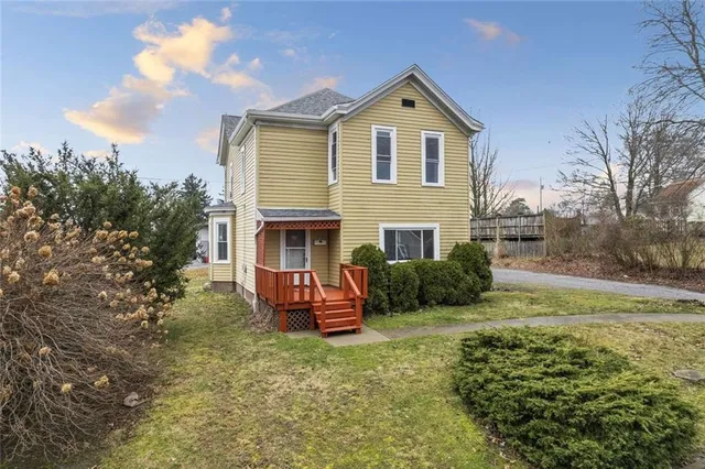 a view of an house with backyard space and garden