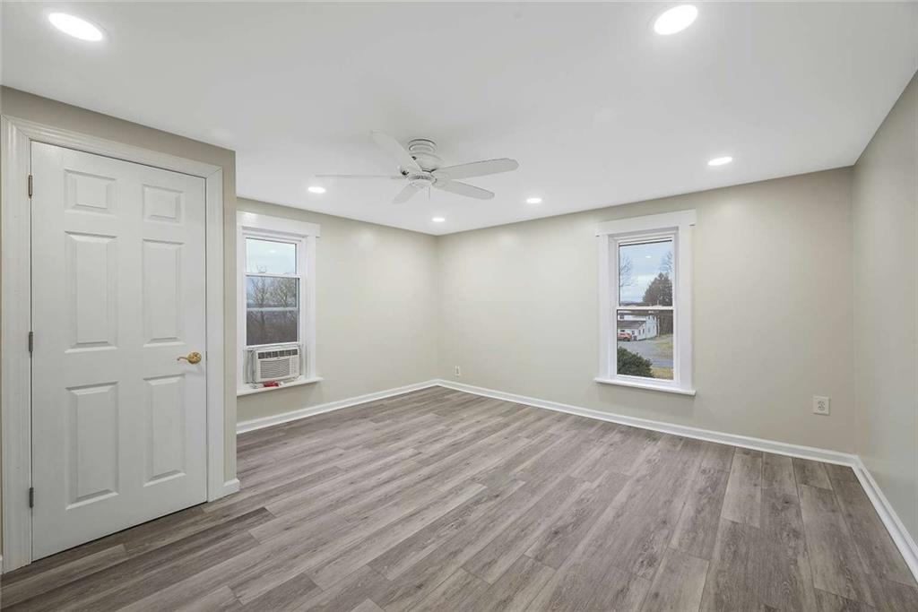 1617 West 9th Street Beaver Falls, PA 15010 - Photo 29 of 43 wooden floor in an empty room with a window