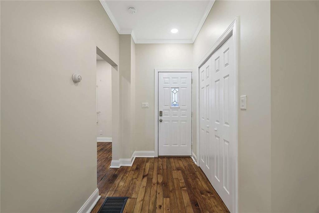 1617 West 9th Street Beaver Falls, PA 15010 - Photo 3 of 43 a view of a hallway with wooden floor and staircase