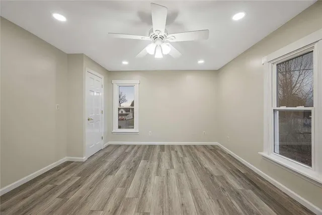a view of balcony with wooden floor
