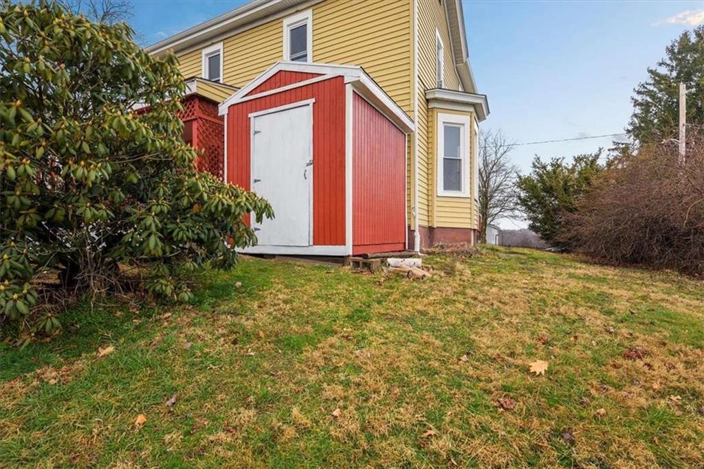 1617 West 9th Street Beaver Falls, PA 15010 - Photo 38 of 43 a view of a house with a yard