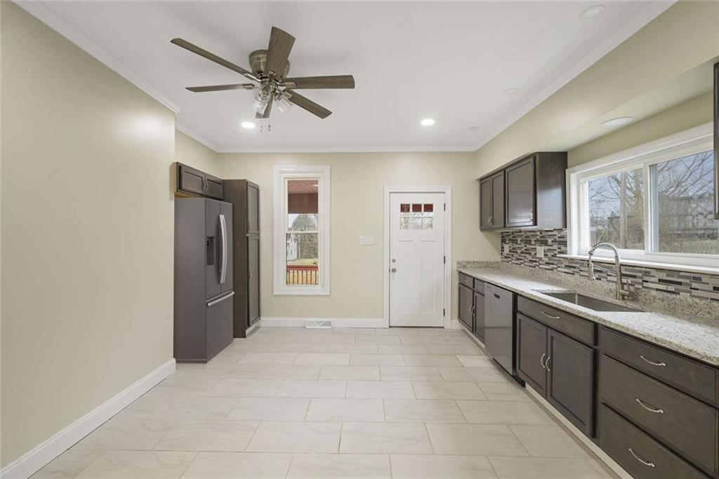 1617 West 9th Street Beaver Falls, PA 15010 - Photo 6 of 43 a view of a kitchen with a sink and a window