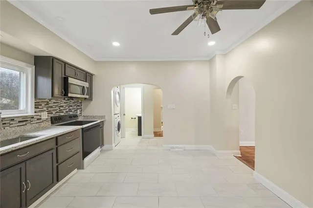 a view of a hallway with washer and dryer