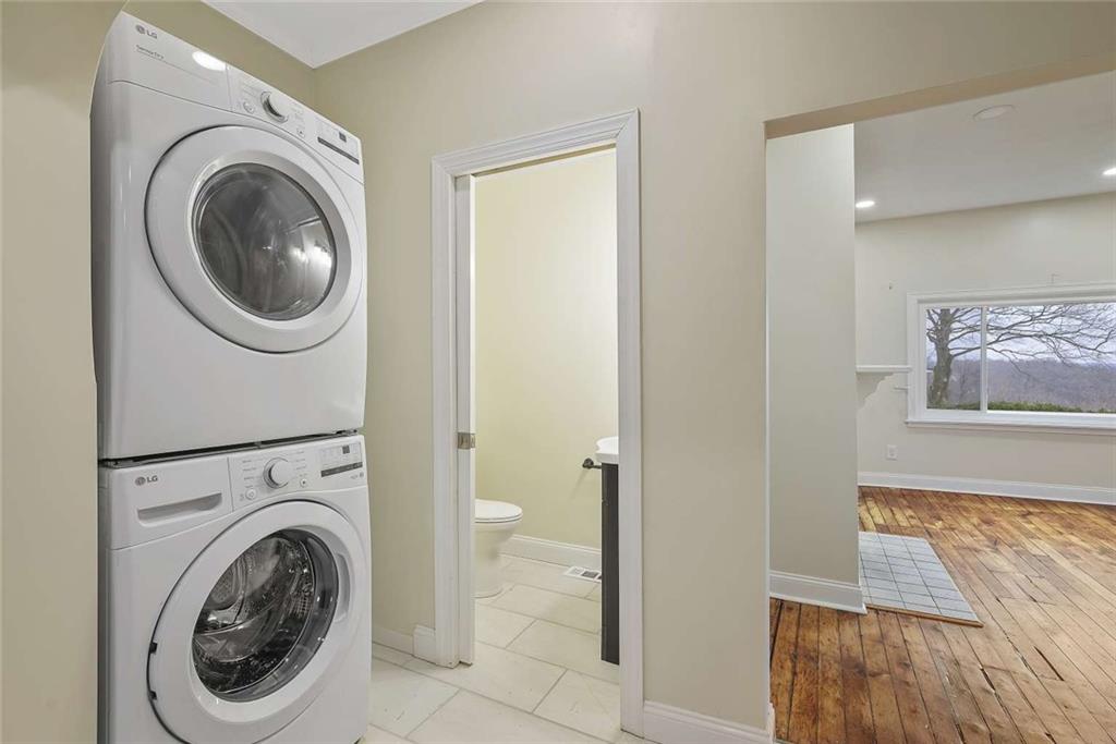 1617 West 9th Street Beaver Falls, PA 15010 - Photo 8 of 43 a view of a hallway with washer and dryer