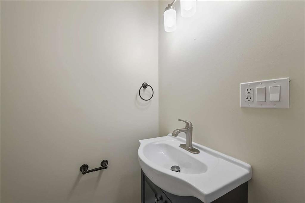 1617 West 9th Street Beaver Falls, PA 15010 - Photo 10 of 43 a bathroom with a sink and mirror