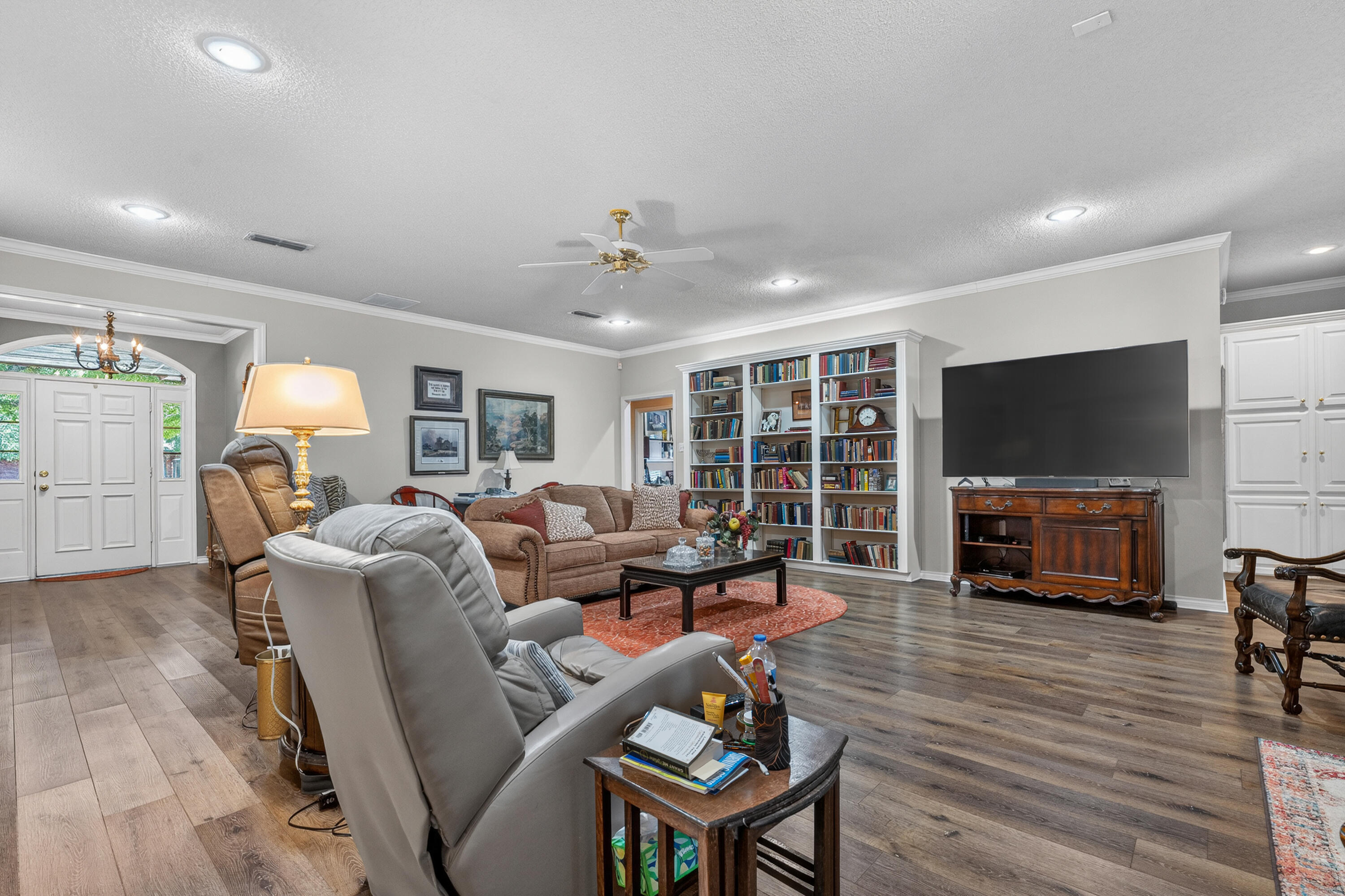 7402 95th Street Lubbock, TX 79424 - Photo 8 of 43 a living room with furniture and a flat screen tv