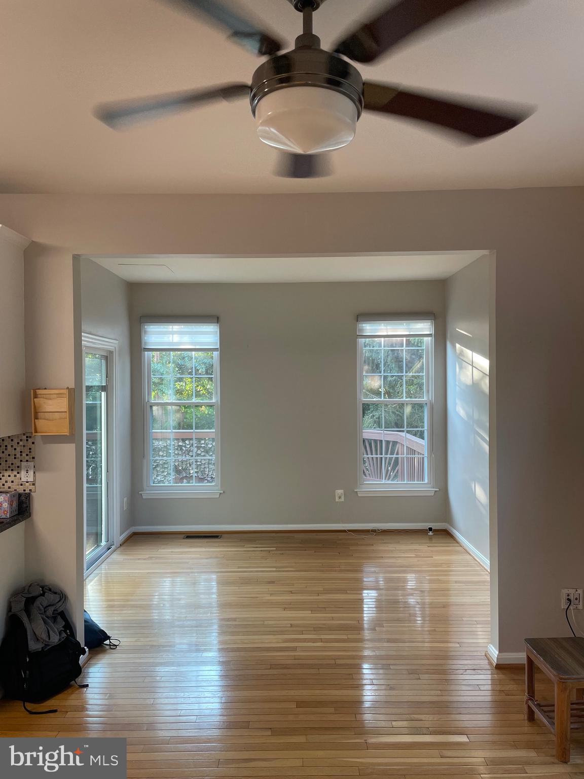 12968 Wood Cres Circle Herndon, VA 20171 - Photo 16 of 33 a view of an empty room with a window and wooden floor