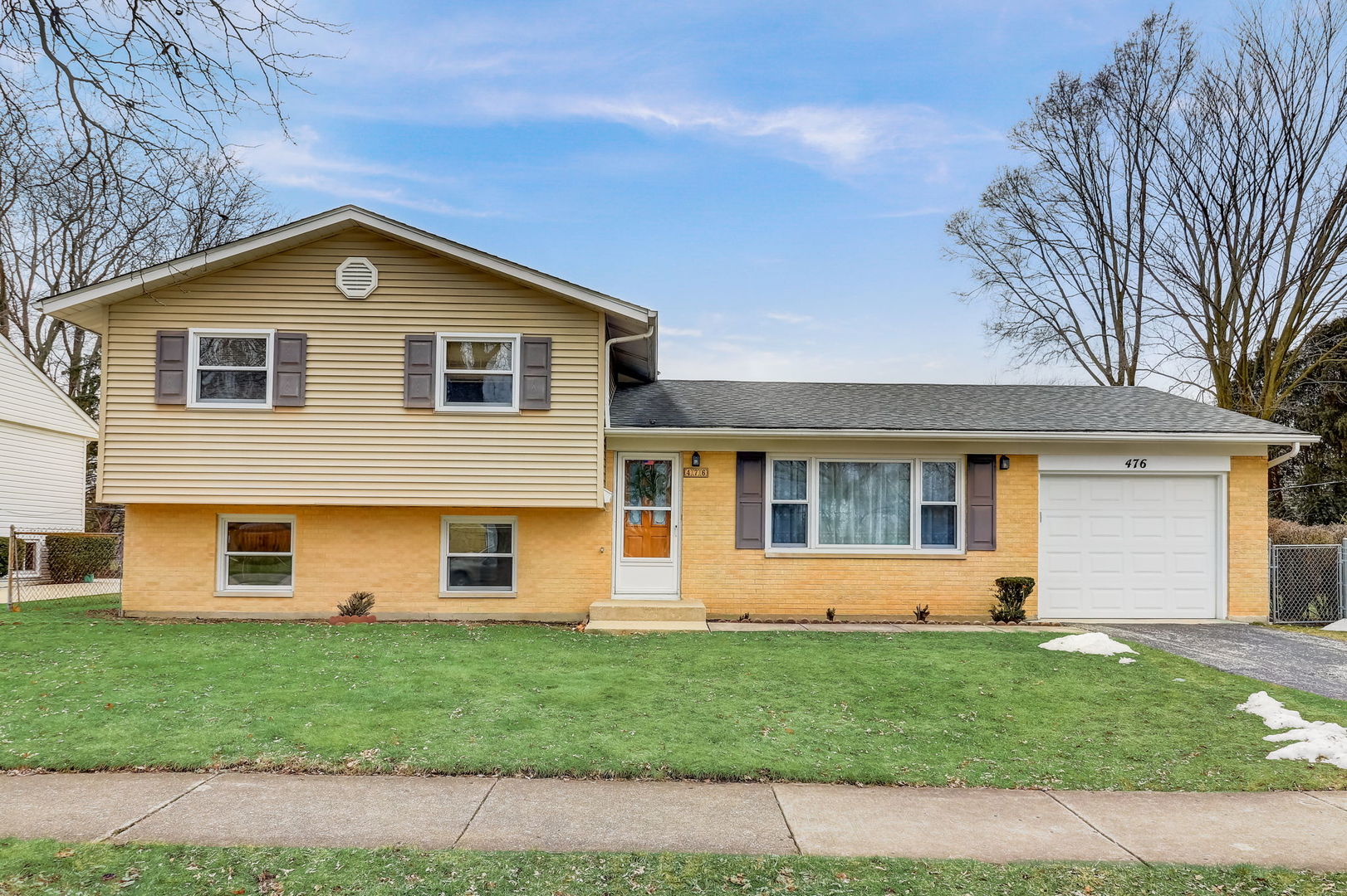a front view of house with yard
