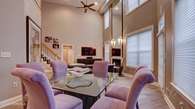 a dining room with furniture and a chandelier