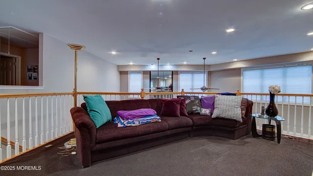 a living room with furniture and a rug