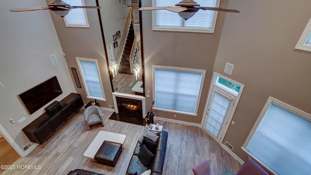 a view of a livingroom with furniture and a flat screen tv
