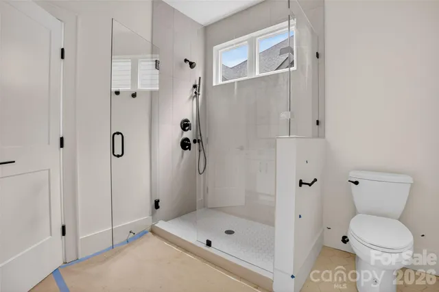 a view of room with window and ceiling fan