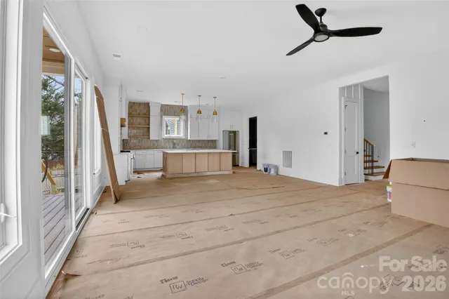 a bed room with a bed and a large window