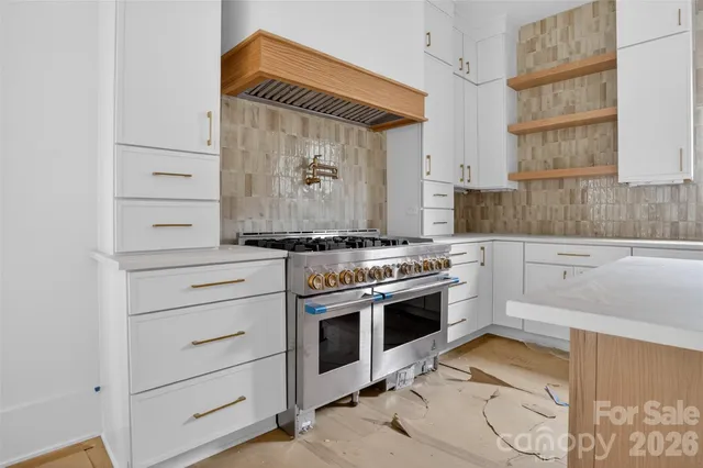a kitchen with a stove and a sink