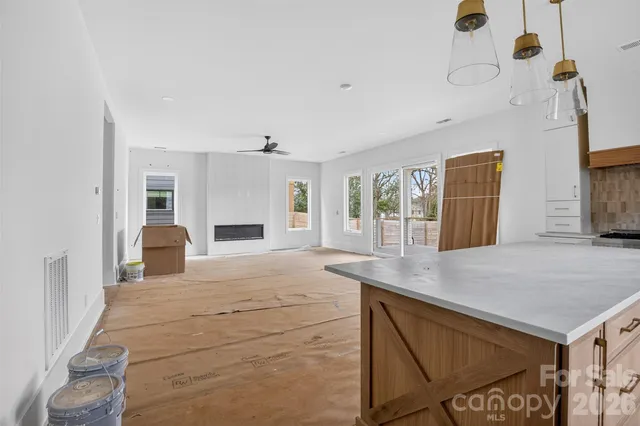 a view of a kitchen with furniture and a kitchen