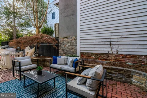 a view of backyard with outdoor seating