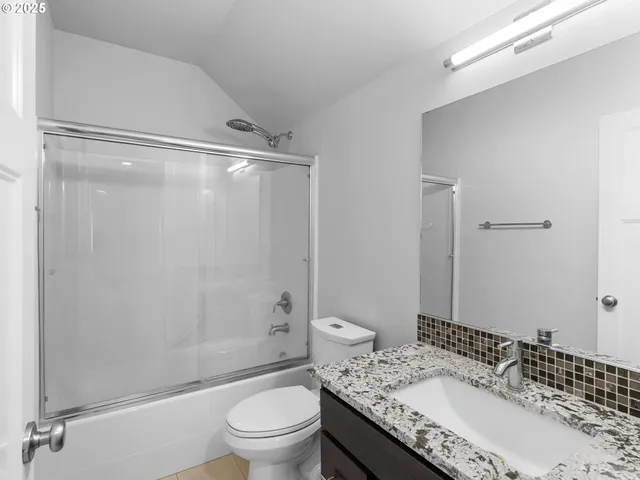 a view of room with window and wooden floor