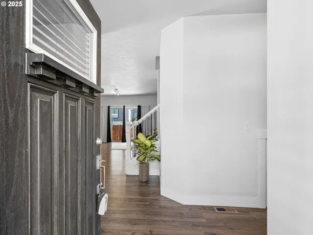 a view of entryway with wooden floor