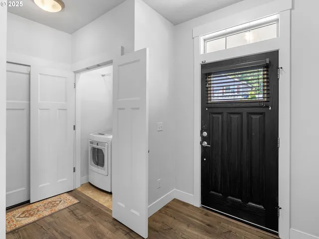 a kitchen with a refrigerator and cabinets