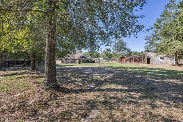 a backyard of a house with lots of green space