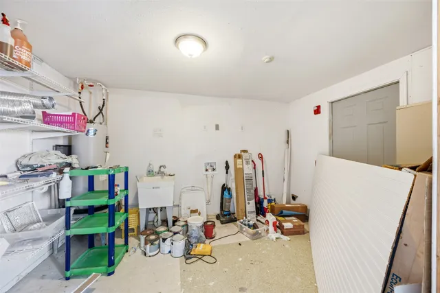 a view of gym equipment with toys and white walls