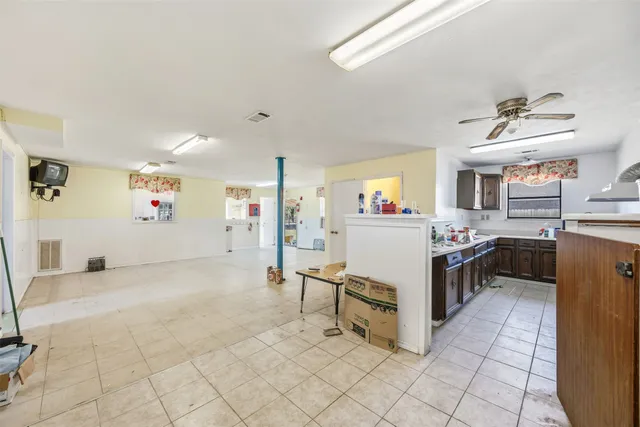 a view of a kitchen with furniture and window