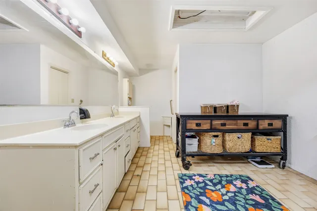 a hallway with a baby crib and furniture